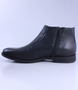 Black men’s leather ankle boot with side zip and cushioned sole.