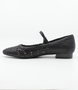 Negro women’s woven leather flat with pointed toe, adjustable strap and low block heel.