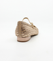 Nude women’s woven leather flat with pointed toe, adjustable strap and low block heel.