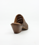 Cuero women’s woven leather mule with pointed toe and stacked heel.