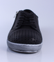 Black women’s punched leather casual sneaker with lace‑up front, side zip and cushioned insole.