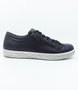 Navy women’s leather sneaker with lace‑up front, side zip and cushioned insole.