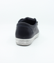 Navy women’s leather sneaker with lace‑up front, side zip and cushioned insole.