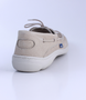 Beige men’s grained leather boat shoe with moccasin stitching and cushioned Poron footbed.