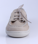 Beige men’s grained leather boat shoe with moccasin stitching and cushioned Poron footbed.