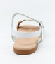White/Tan girls’ woven leather flat sandal with ankle strap and cushioned footbed.