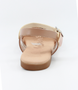 Nude girls’ woven leather flat sandal with ankle strap and cushioned footbed.