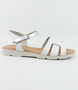 White girls’ woven leather flat sandal with ankle strap and cushioned footbed.