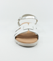 White girls’ woven leather flat sandal with ankle strap and cushioned footbed.