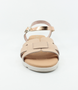 Nude girls’ woven leather flat sandal with ankle strap and cushioned footbed.