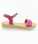 Fuchsia girls’ leather platform sandal with ankle strap and cushioned footbed.