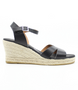 Black women’s criss‑cross leather wedge sandal with ankle strap and cushioned footbed.