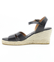 Black women’s criss‑cross leather wedge sandal with ankle strap and cushioned footbed.