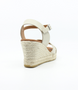 Ice women’s criss‑cross leather wedge sandal with ankle strap and cushioned footbed.