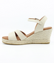 Ice women’s criss‑cross leather wedge sandal with ankle strap and cushioned footbed.