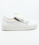 White women’s leather casual sneaker with oversized laces, side zip and cushioned removable insole.