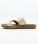 Cream women’s buckle‑detail flat slide sandal with textured toe loop and cushioned footbed.