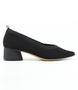 Black women’s ribbed flyknit low‑heel pump with pointed toe and cushioned footbed.