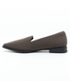 Chocolate women’s perforated flyknit slip‑on flat with notched vamp and cushioned footbed.
