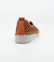 Red women’s nubuck perforated slip‑on with scalloped pattern, contrast stitching and cushioned sole.