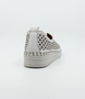 White women’s nubuck perforated slip‑on with scalloped pattern, contrast stitching and cushioned sole.