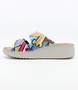 Multi women’s leather slide sandal with twin buckle straps and stitched platform sole.