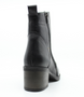 Black women’s leather ankle boot with side zip, rounded toe and mid‑height block heel.