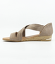 Taupe women’s suede low‑wedge sandal with crossover straps, enclosed heel and jute trim.