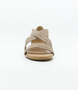 Taupe women’s suede low‑wedge sandal with crossover straps, enclosed heel and jute trim.