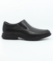 Black men’s leather slip‑on dress shoe with elastic gussets and cushioned sole.