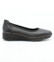Black women's leather slip-on shoe with cushioned footbed and flexible platform sole.