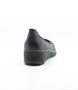 Black women's leather slip-on shoe with cushioned footbed and flexible platform sole.