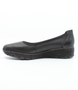 Black women's leather slip-on shoe with cushioned footbed and flexible platform sole.