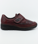 Red women's leather/fabric slip-on shoe with patterned forefoot and cushioned footbed.