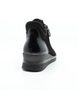 Black women's leather ankle sneaker with mixed textures, side zipper and cushioned footbed.