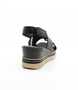 Schwarz women's leather wedge sandal with woven crossover straps, slingback design and cushioned footbed.