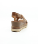 Muskat women's leather wedge sandal with woven crossover straps, slingback design and cushioned footbed.