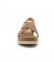 Muskat women's leather wedge sandal with woven crossover straps, slingback design and cushioned footbed.