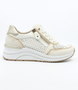 Cream women's leather sneaker with perforated upper, side zipper and wedge sole.