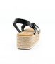 Black women's leather sandal with crossover straps, adjustable ankle strap and cushioned footbed.