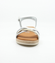 White girls' leather sandal with crossover straps, woven detailing, buckle fastening and cushioned footbed.