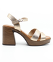 Champagne women's textured leather sandal with open toe, buckle strap and cushioned footbed.