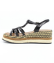 Black women's raffia platform sandal with braided straps, woven midsole and adjustable ankle strap.