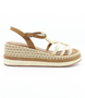 Brown women's raffia platform sandal with braided straps, woven midsole and adjustable ankle strap.