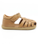 Caramel unisex leather sandal with closed heel, woven straps and hook-and-loop fastening.