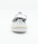 Silver girls' leather shoe with closed heel, protective toe cap and hook‑and‑loop fastening.