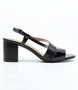 Black women's block-heel sandal with patent front strap and adjustable ankle buckle.