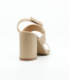 Beige White women's block-heel sandal with two wide straps and adjustable slingback buckle.