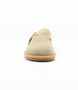 Beige women's suede clog slide with adjustable buckle, fleece lining and flexible sole.