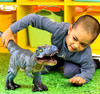 Jumbo 23 inch blue T-rex dionsaur toy figure for children - Child playing view